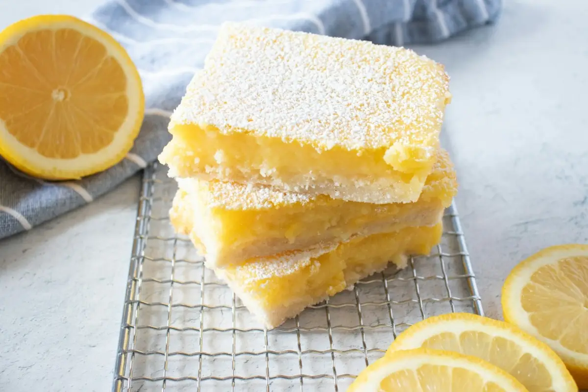 yellow cake on white and black checkered textile